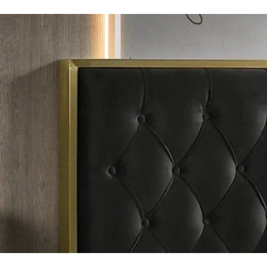 Dark gray tufted headboard with gold frame