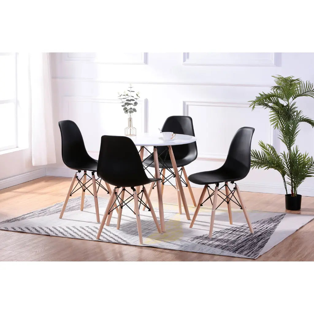 Dining room set with a round table and black chairs