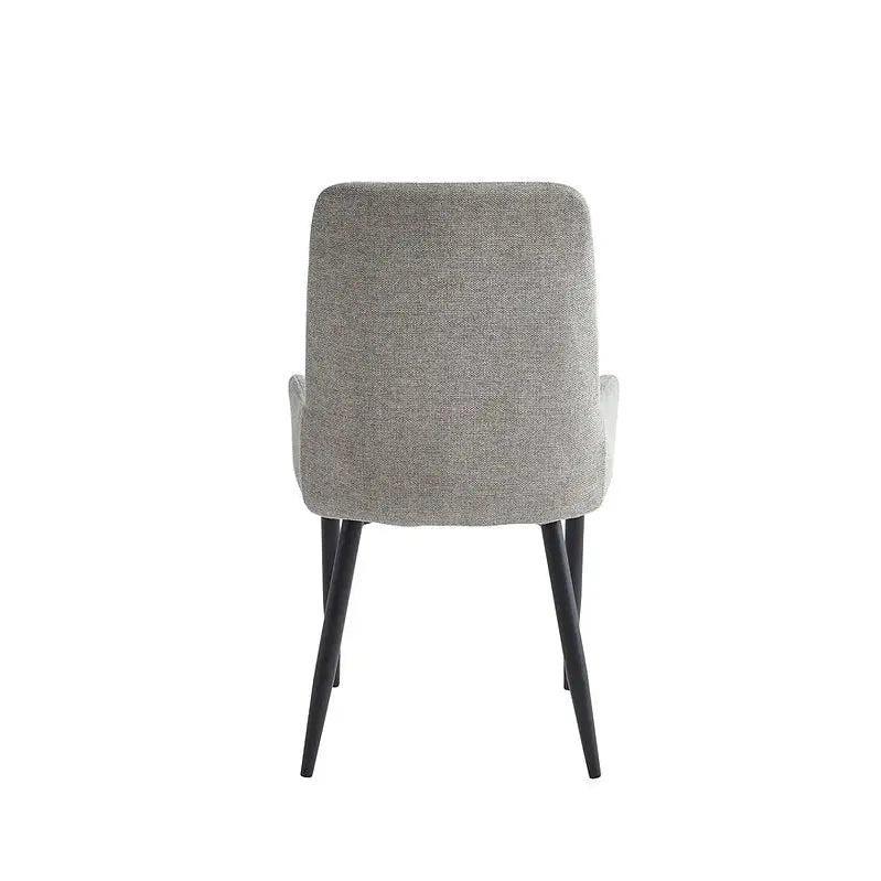 Grey upholstered dining chair with black legs