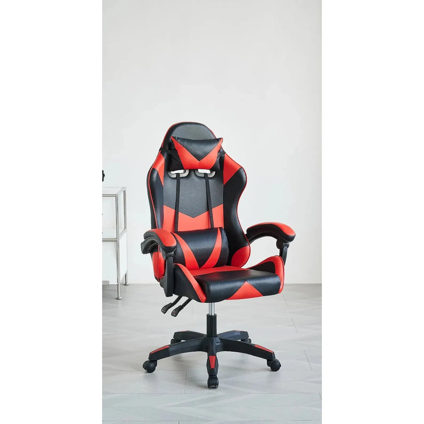 Black and red gaming chair with a white wall background