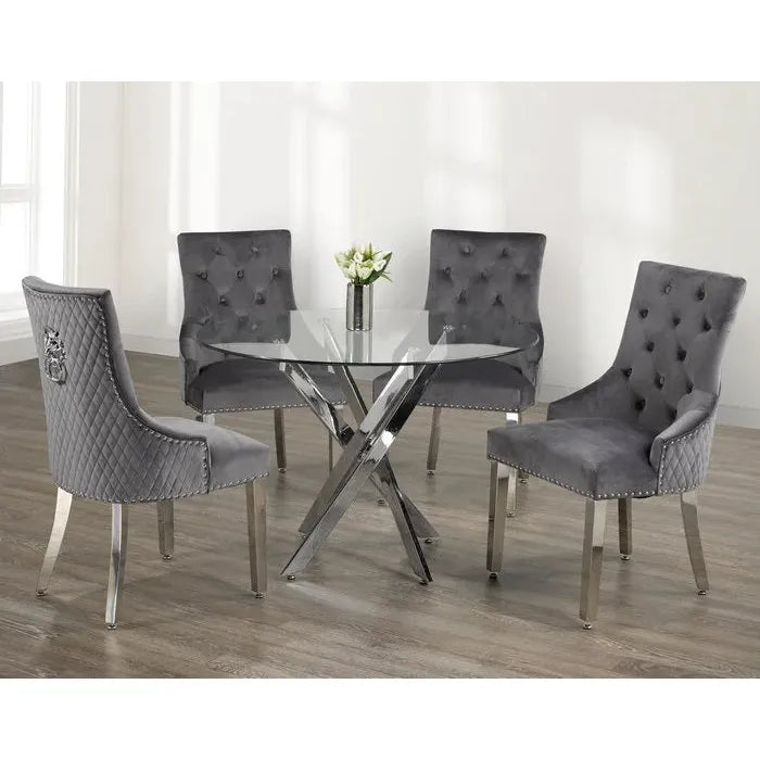 Dining set with a round glass table and grey tufted chairs