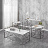 Set of marble coffee table and side tables with metal frames in a modern interior setting.