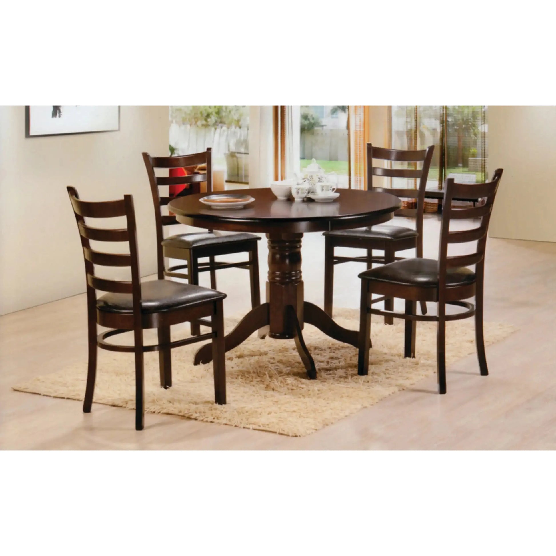 Dining room set with a round dark wood table and four matching chairs 