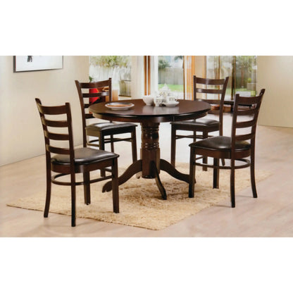 Dining room set with a round dark wood table and four matching chairs 