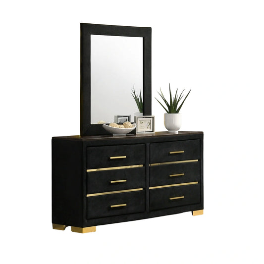 Black dresser with gold accents and a mirror 