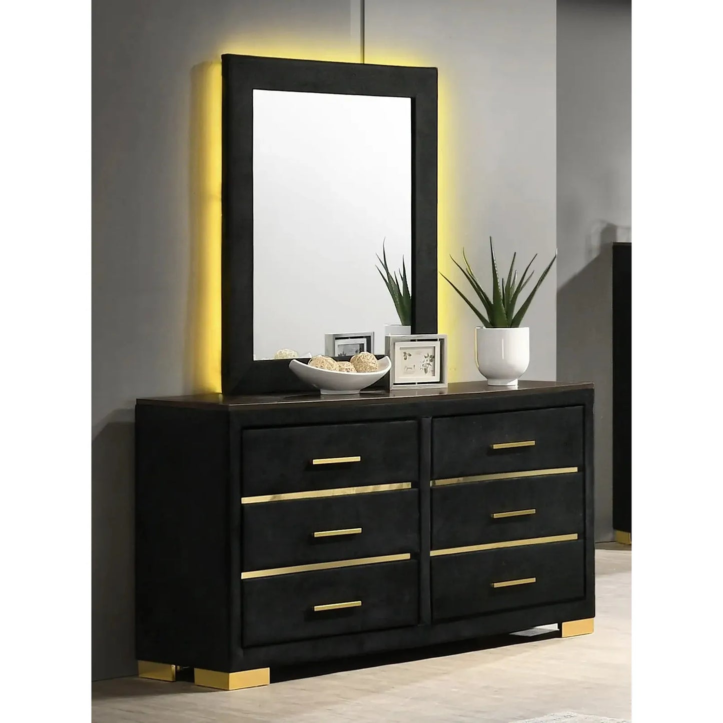 dresser with gold accents and a mirror 