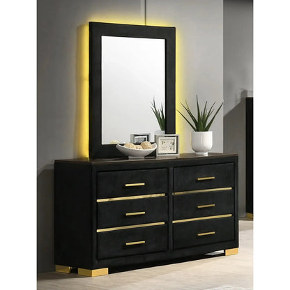 dresser with gold accents and a mirror 