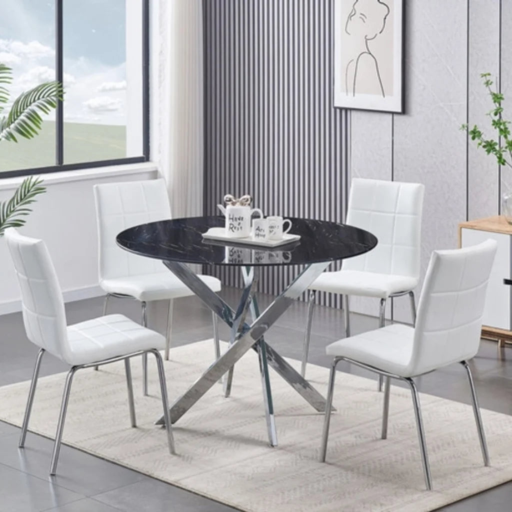 Dining room set with a round black dining table and white chairs