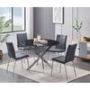 Dining room set with a round black table and four grey PU chairs.