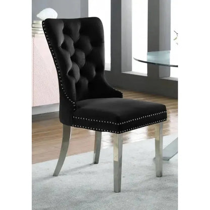 Black upholstered dining chair with silver nail heads