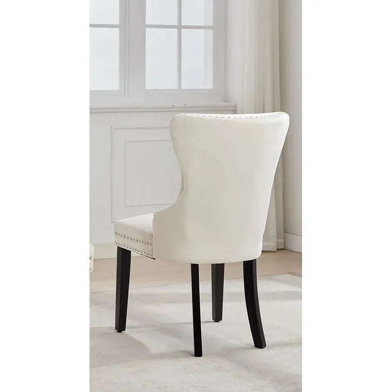 Cream upholstered chair with dark legs 