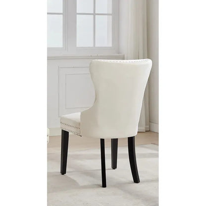 Cream upholstered chair with dark legs 