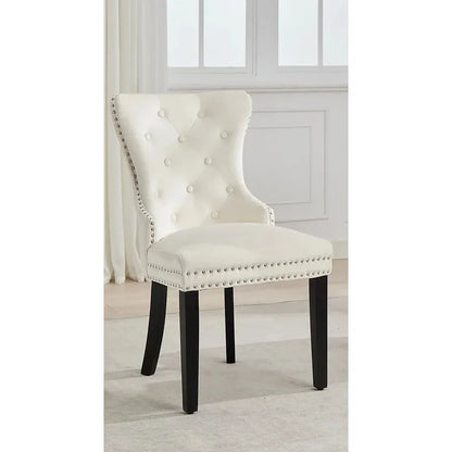 Cream upholstered chair with black legs 