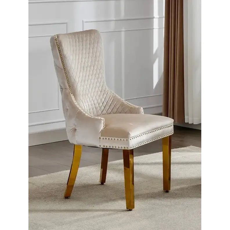 Creme upholstered chair with gold legs 