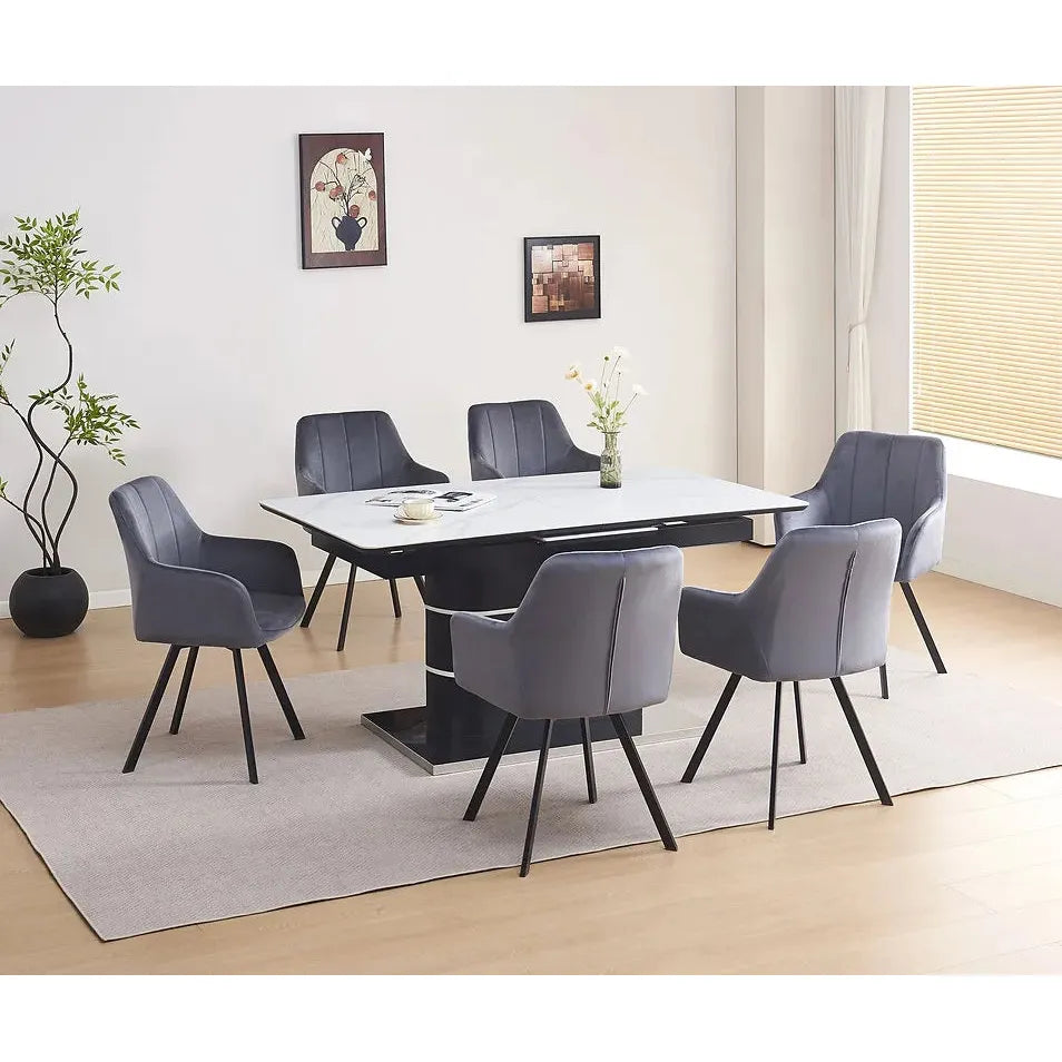 Dining room set with a white marble table and gray chairs.