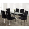 Black tufted chairs with silver legs with  a glass dining dining table.