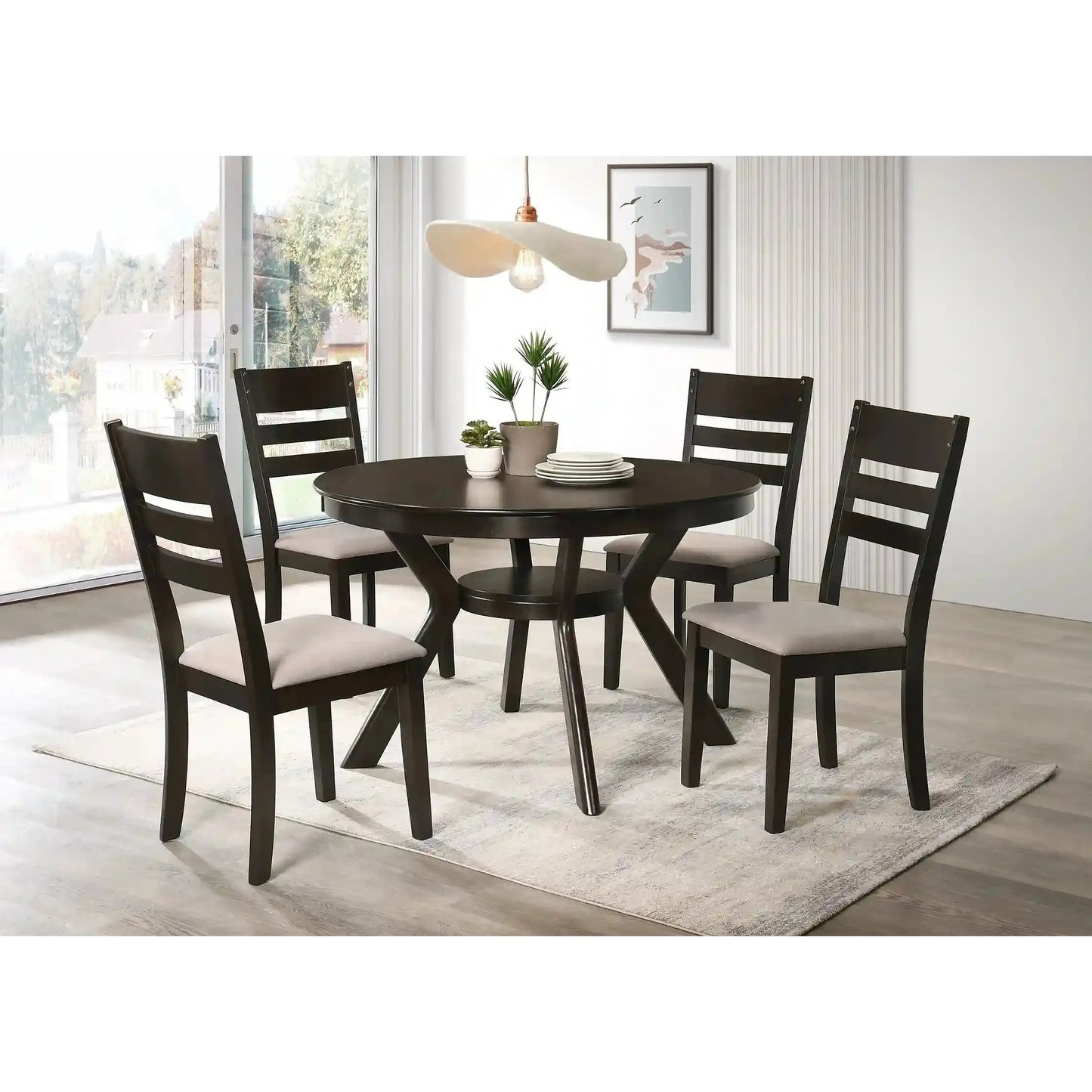 Dining room with a dark wooden round dining table and four matching chairs with light gray cushions