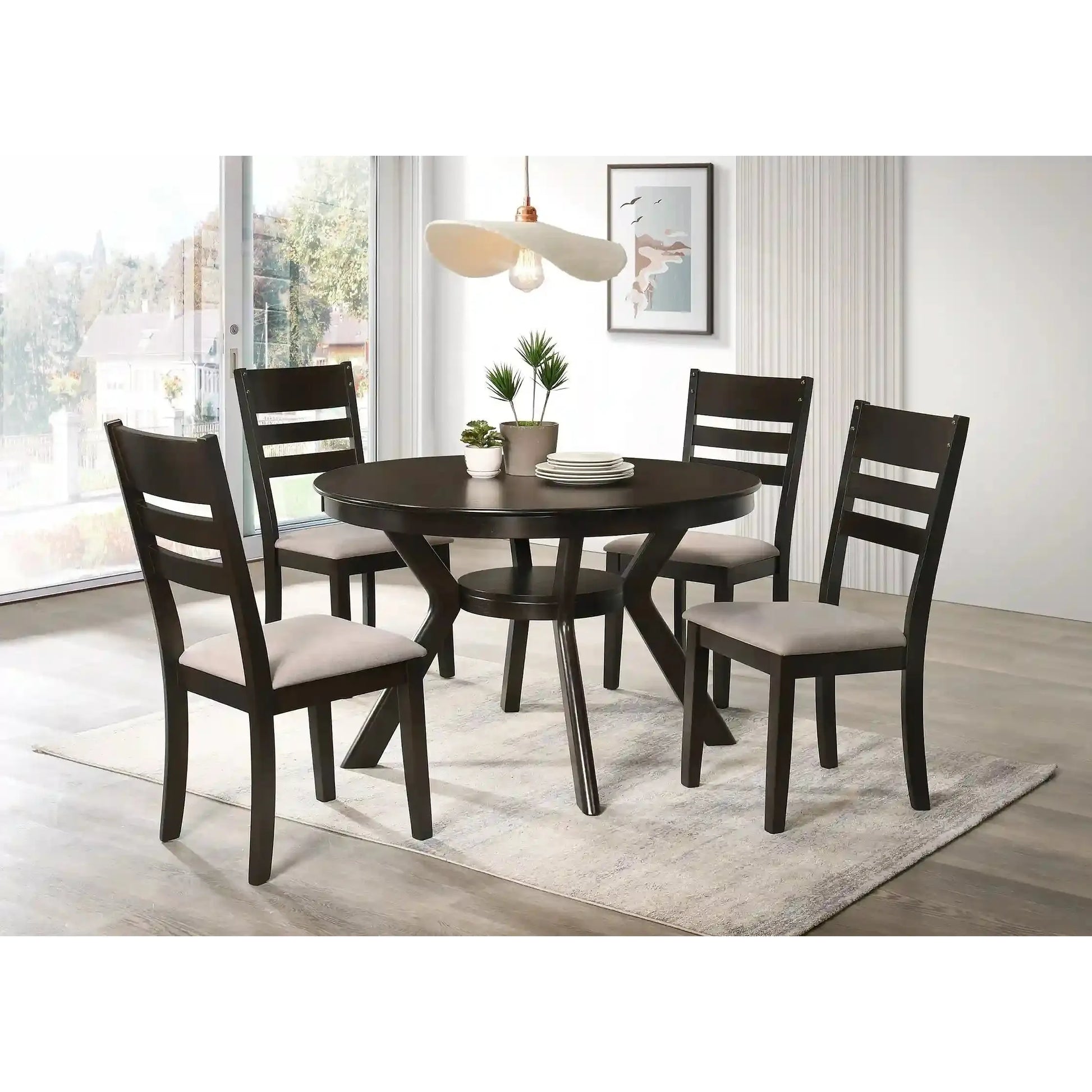 Dining room with a dark wooden round dining table and four matching chairs with light gray cushions