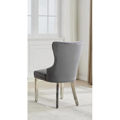 Gray upholstered chair with studded details