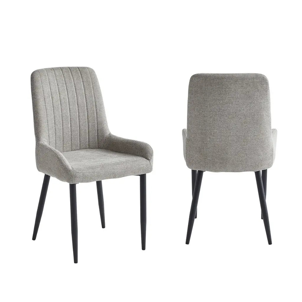 gray fabric upholstered dining chairs with black metal  legs 