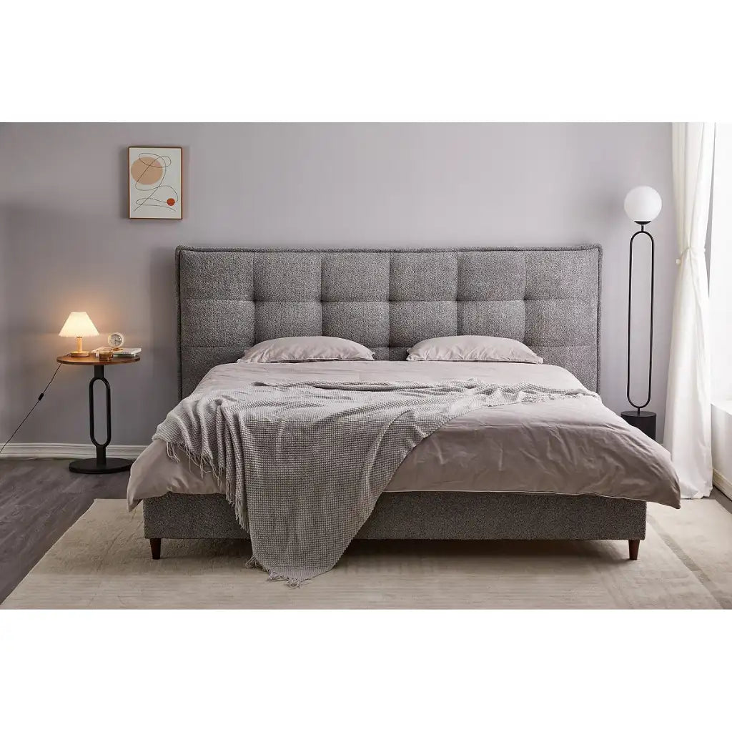 Grey upholstered bed 
