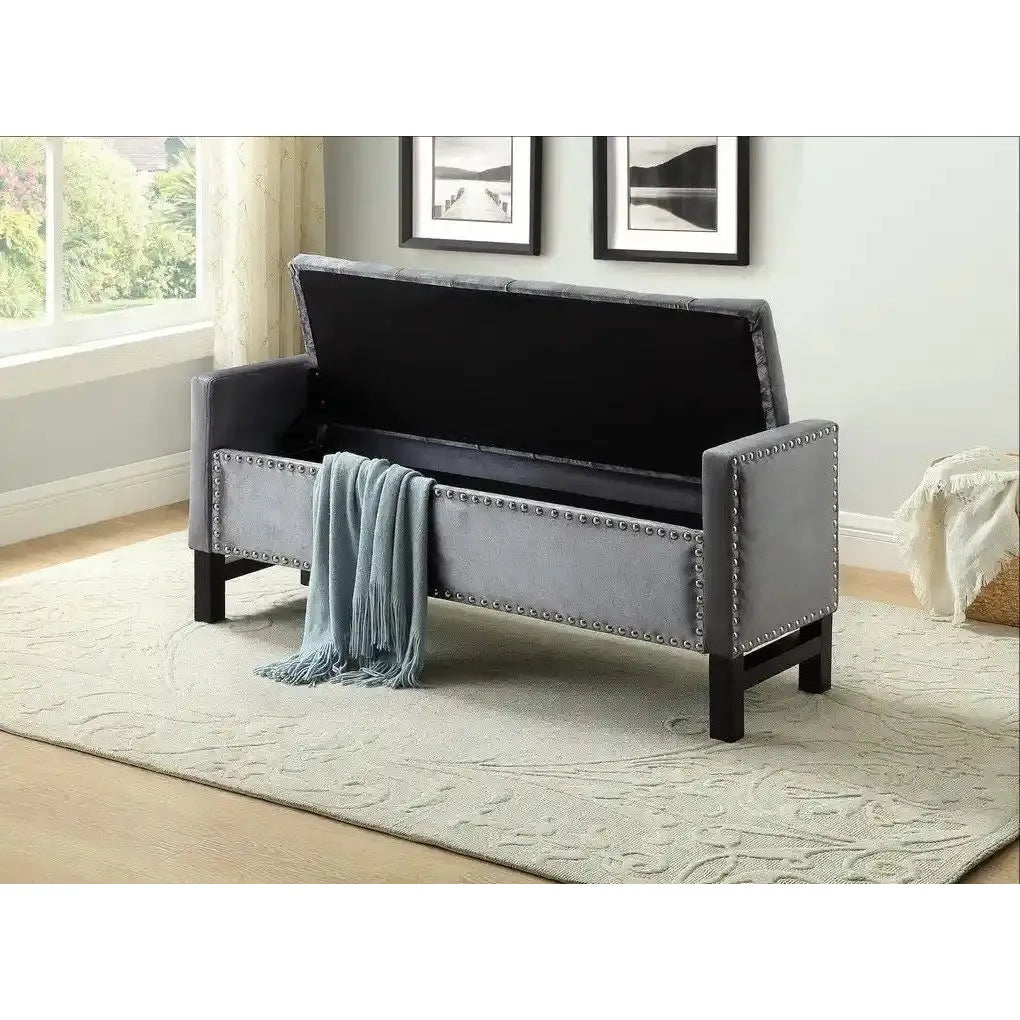 Grey upholstered bench with black legs
