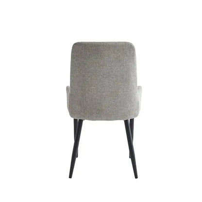 Grey upholstered dining chair with black legs 