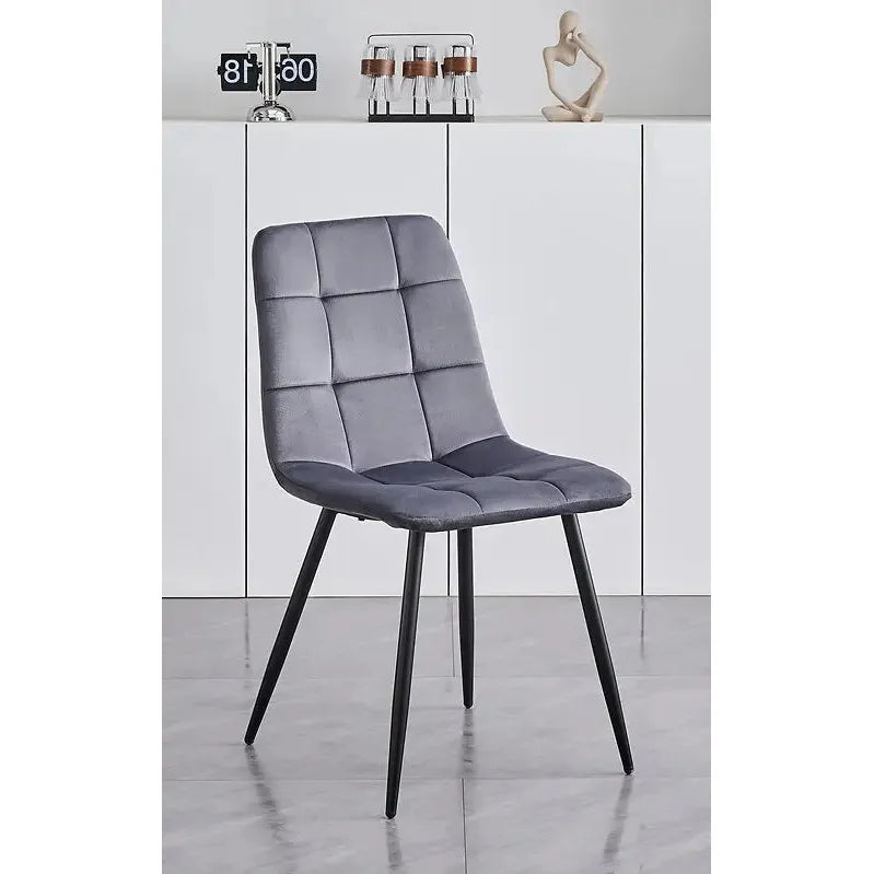 Gray upholstered dining chair with black legs 