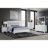 Modern bedroom set with white bed, nightstands, and dresser.