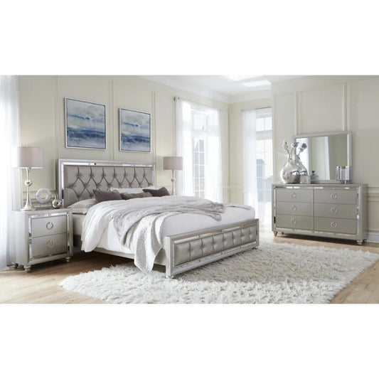 Modern bedroom set with grey furniture including bed, nightstands, storage chest and dresser.