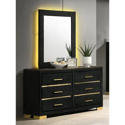 Black dresser and mirror with gold accents 