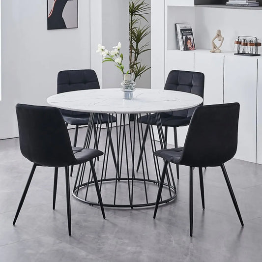Round dining table set with four black chairs 