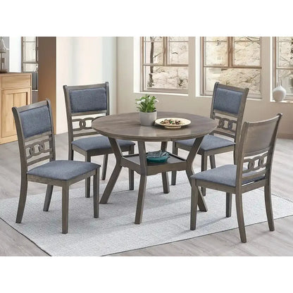 Dining room set with round table and four fabric chairs