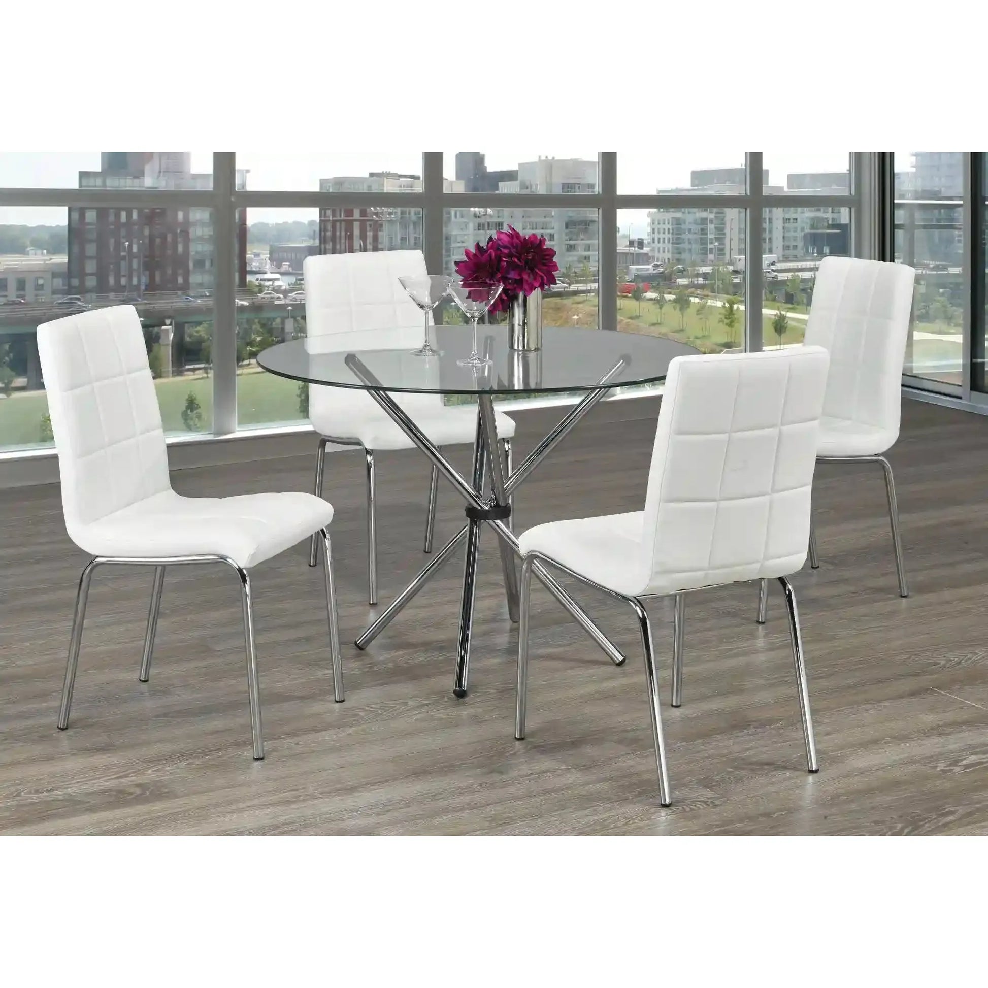 Dining room set with  round  glass table and white chairs 