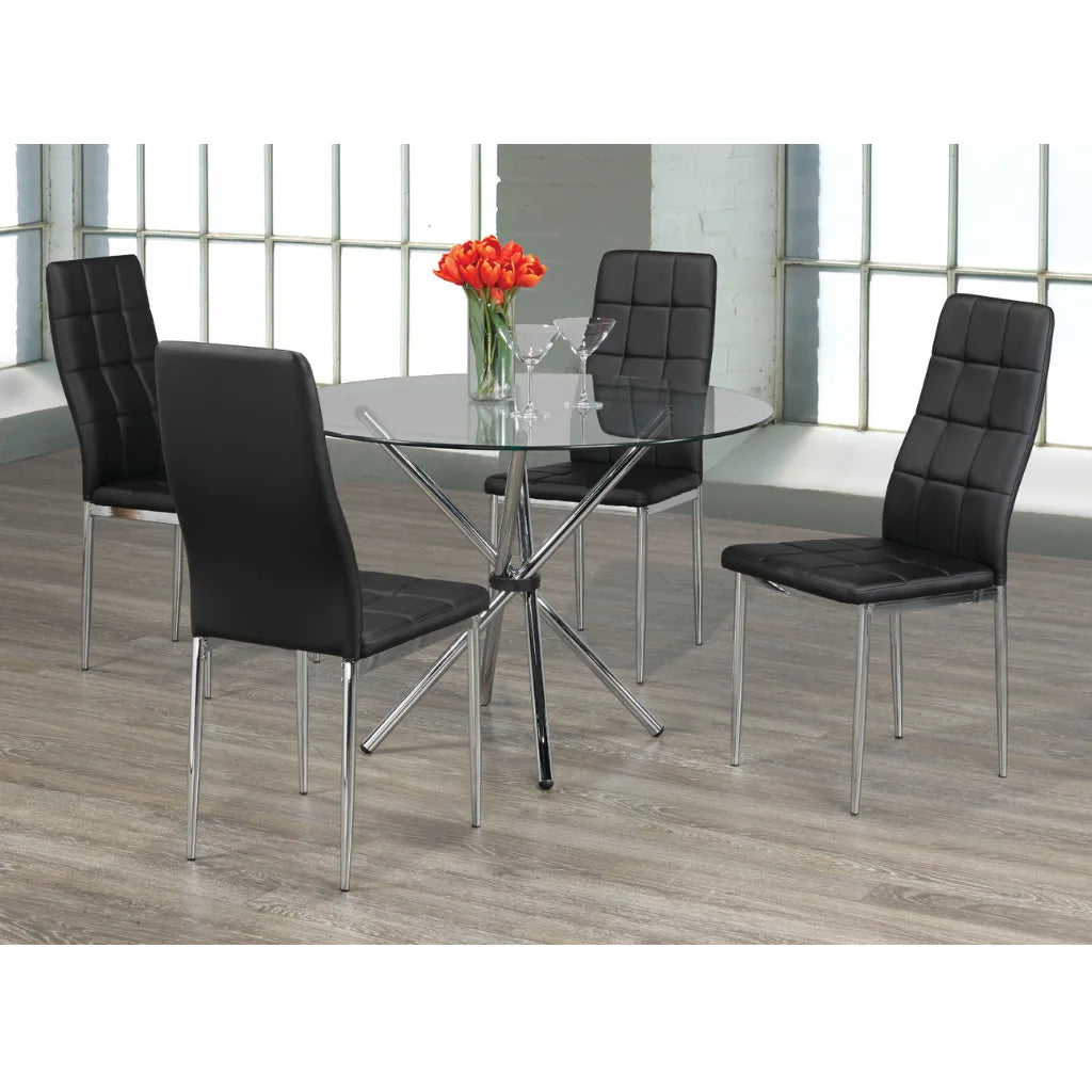 Dining room set with black chairs and a round glass table.