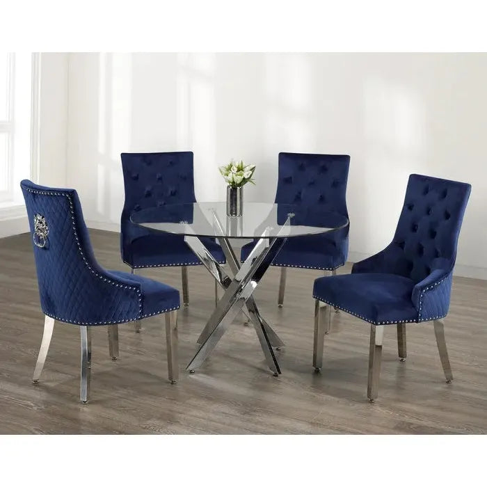 Dining set with four blue chairs and a round glass table 