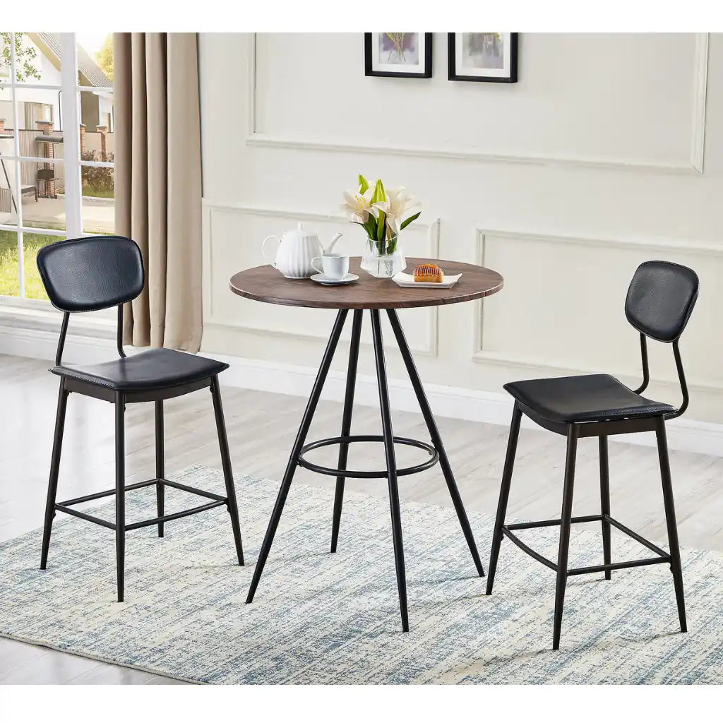Round wooden bar table with two black bar stools