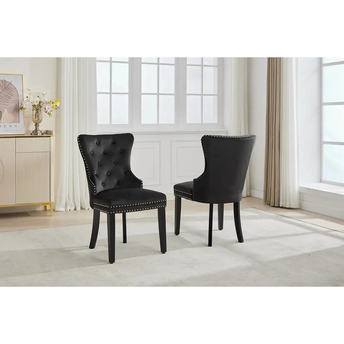 Set Of Two black tufted chairs 