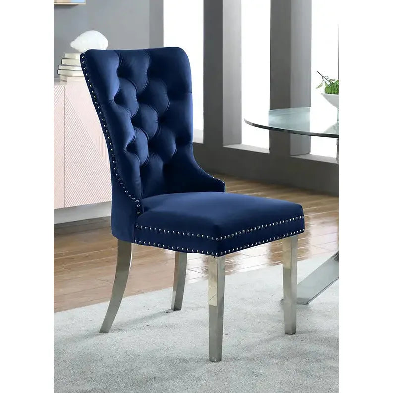 Blue tufted accent chair with silver nailheads 
