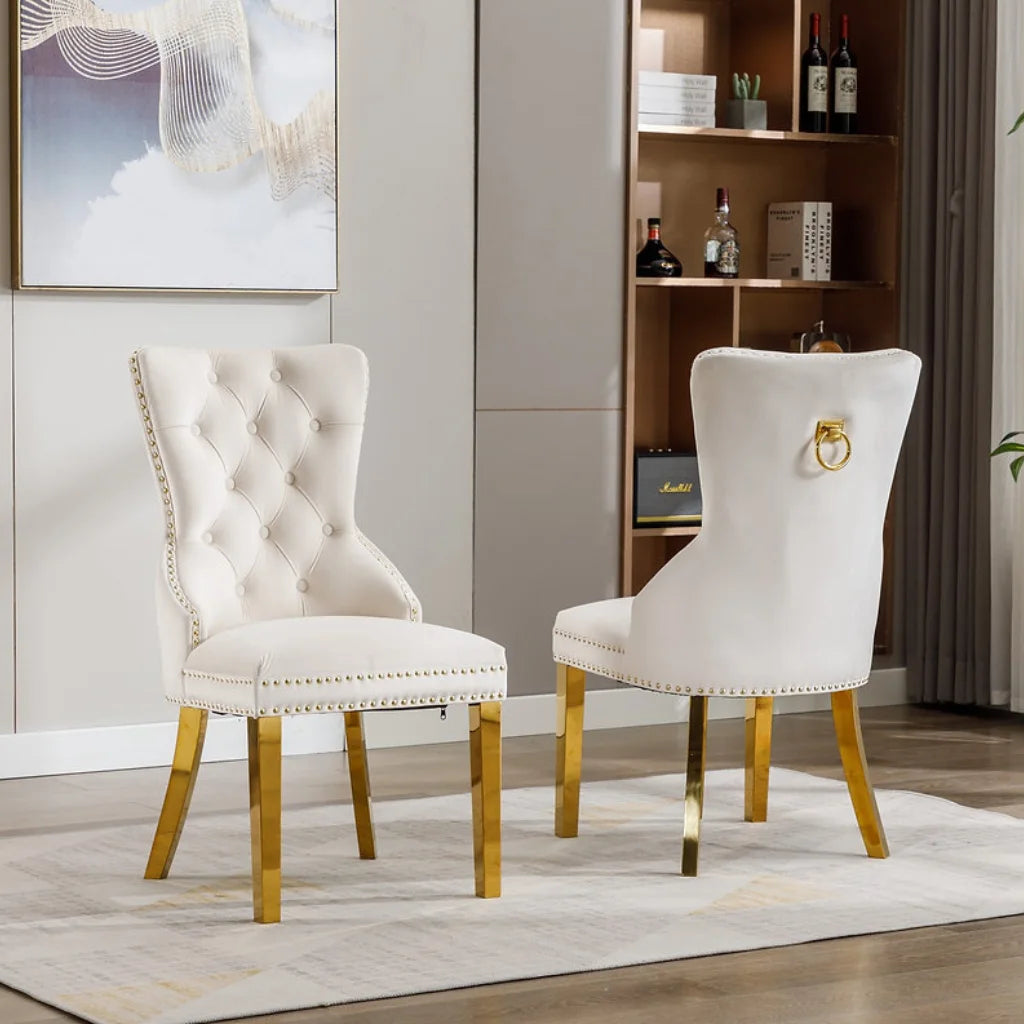 Set Of Two white upholstered chairs with gold legs