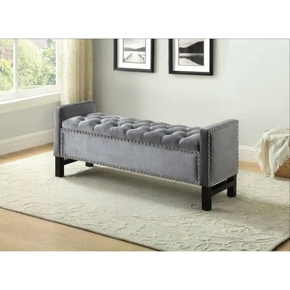 Grey tufted bench with nailhead trim