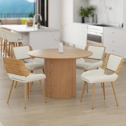 Dining area with wooden table and chairs in a modern kitchen.