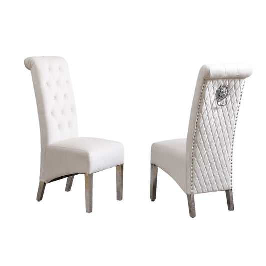 Two white chairs with decorative backrests