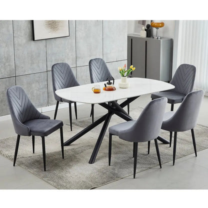 White marble dining table set with six grey velvet chairs 