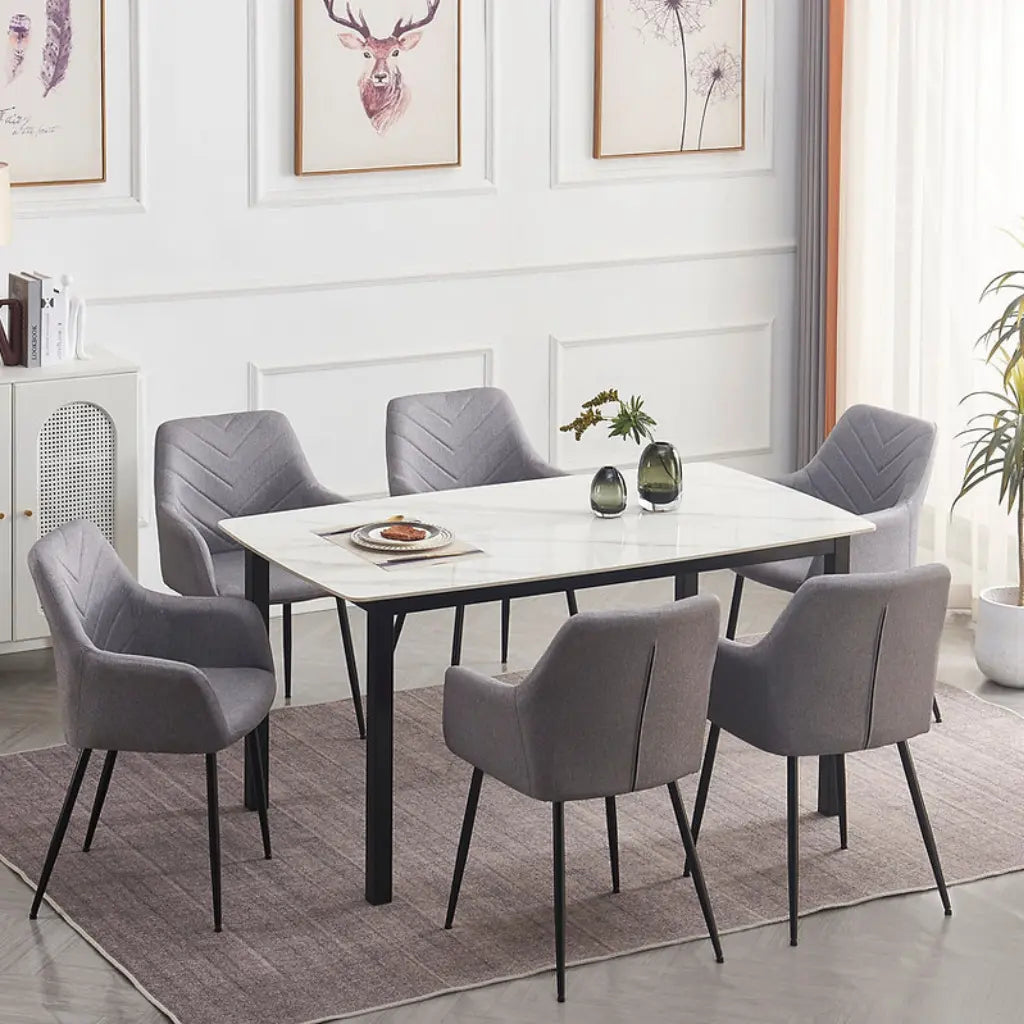 Dining room set with a marble table and gray velvet chairs 