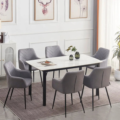 Dining room set with a marble table and gray velvet chairs 