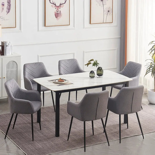 Dining room set with a marble table and gray velvet chairs 