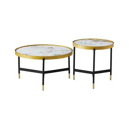 Set of two round coffee tables with gold rims and black legs 