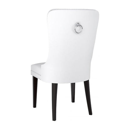 Back of white dining chair with black legs 