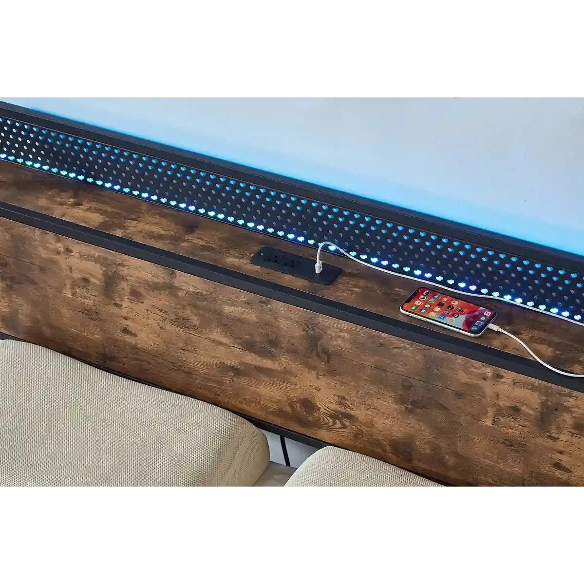 Wooden Bed surface with LED strip lighting and a smartphone charging cable.